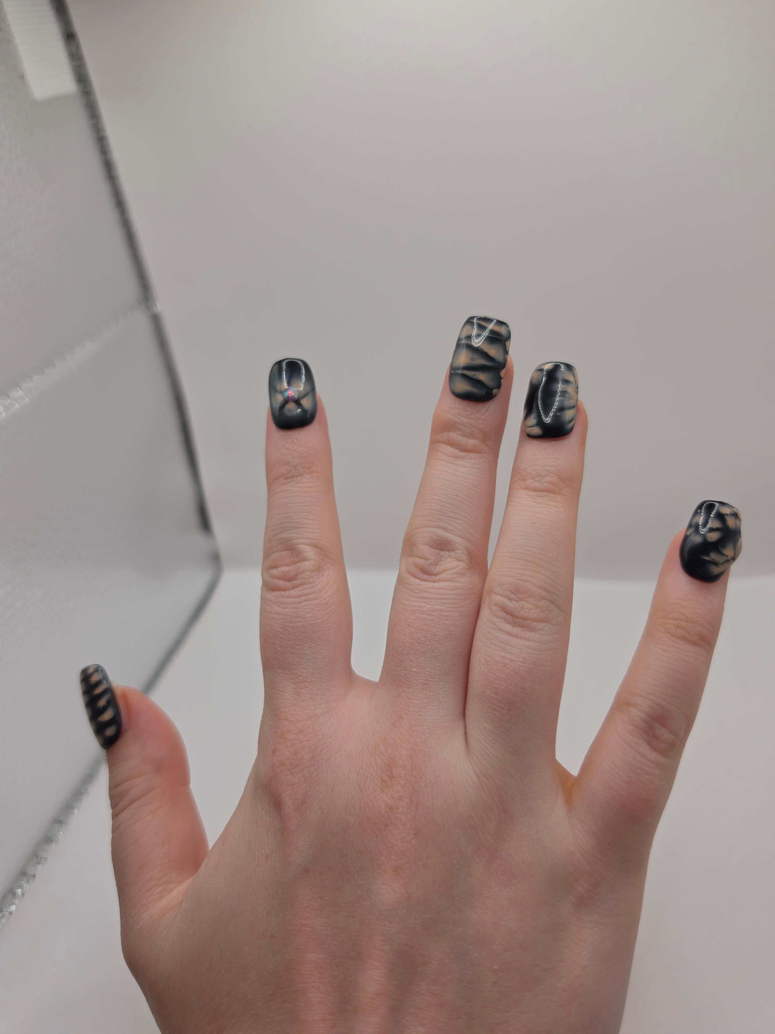 Black and petal pink nails