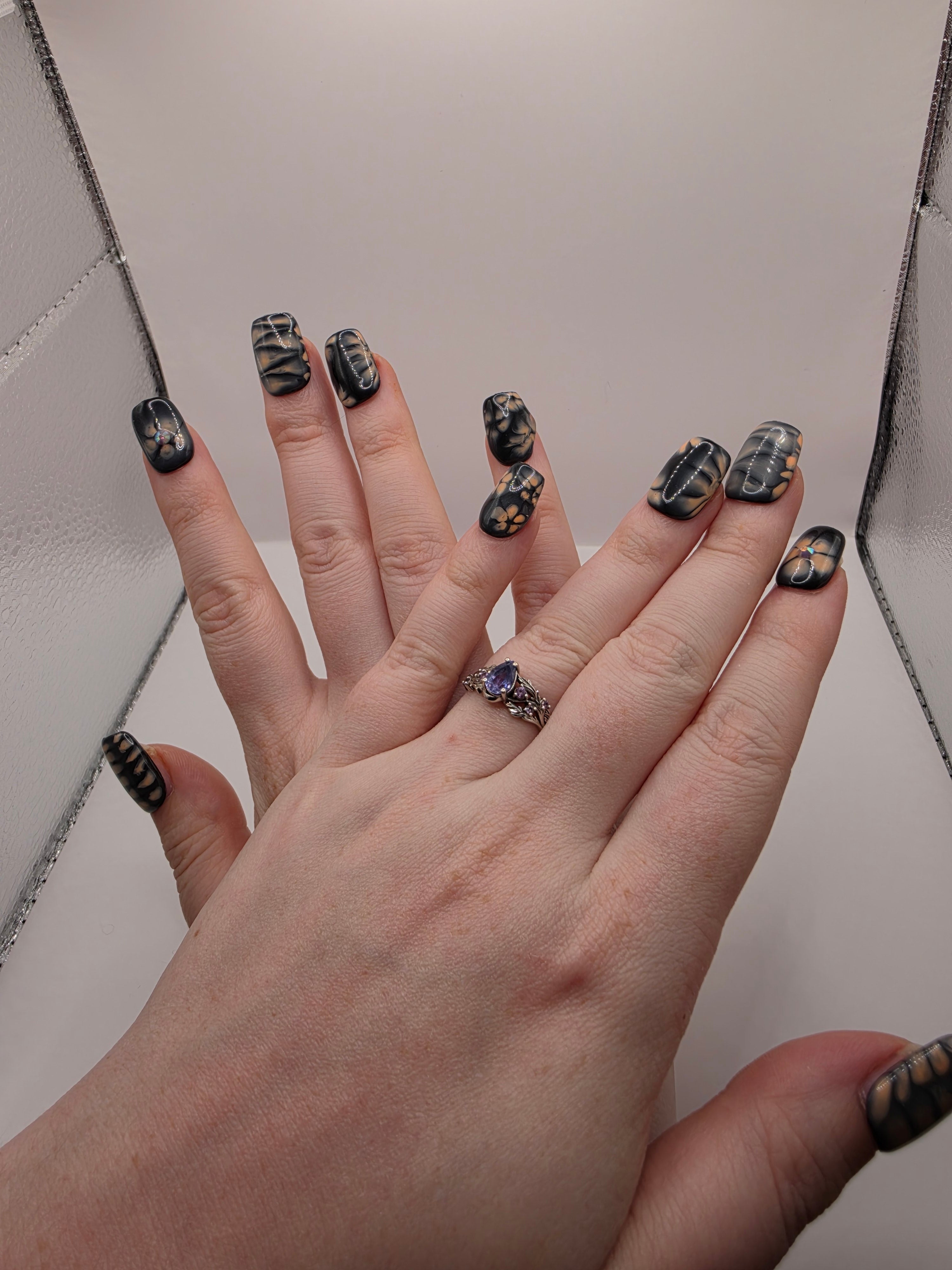 Black and petal pink nails