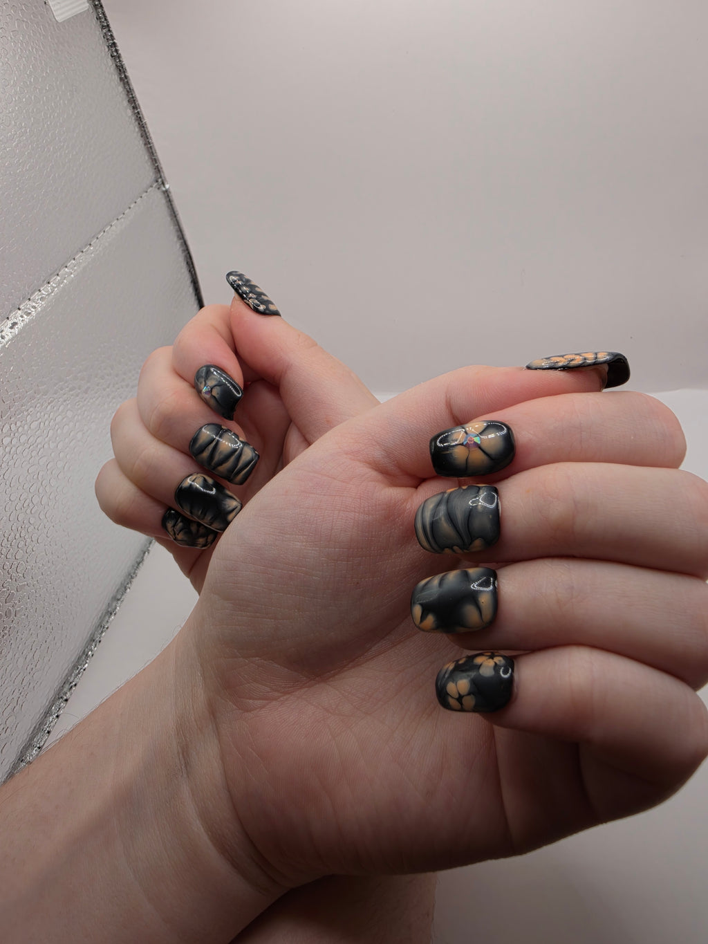 Black and petal pink nails