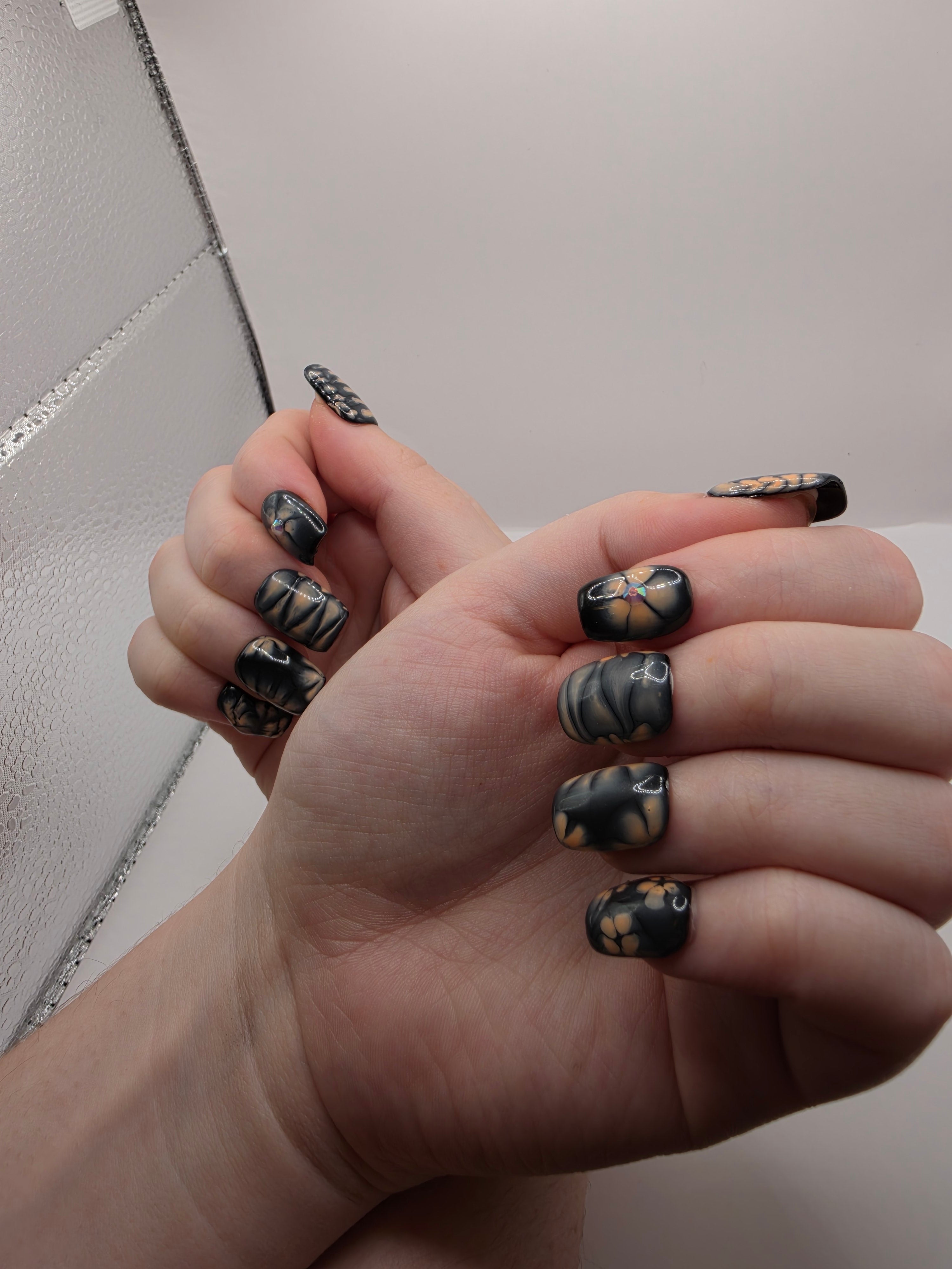 Black and petal pink nails