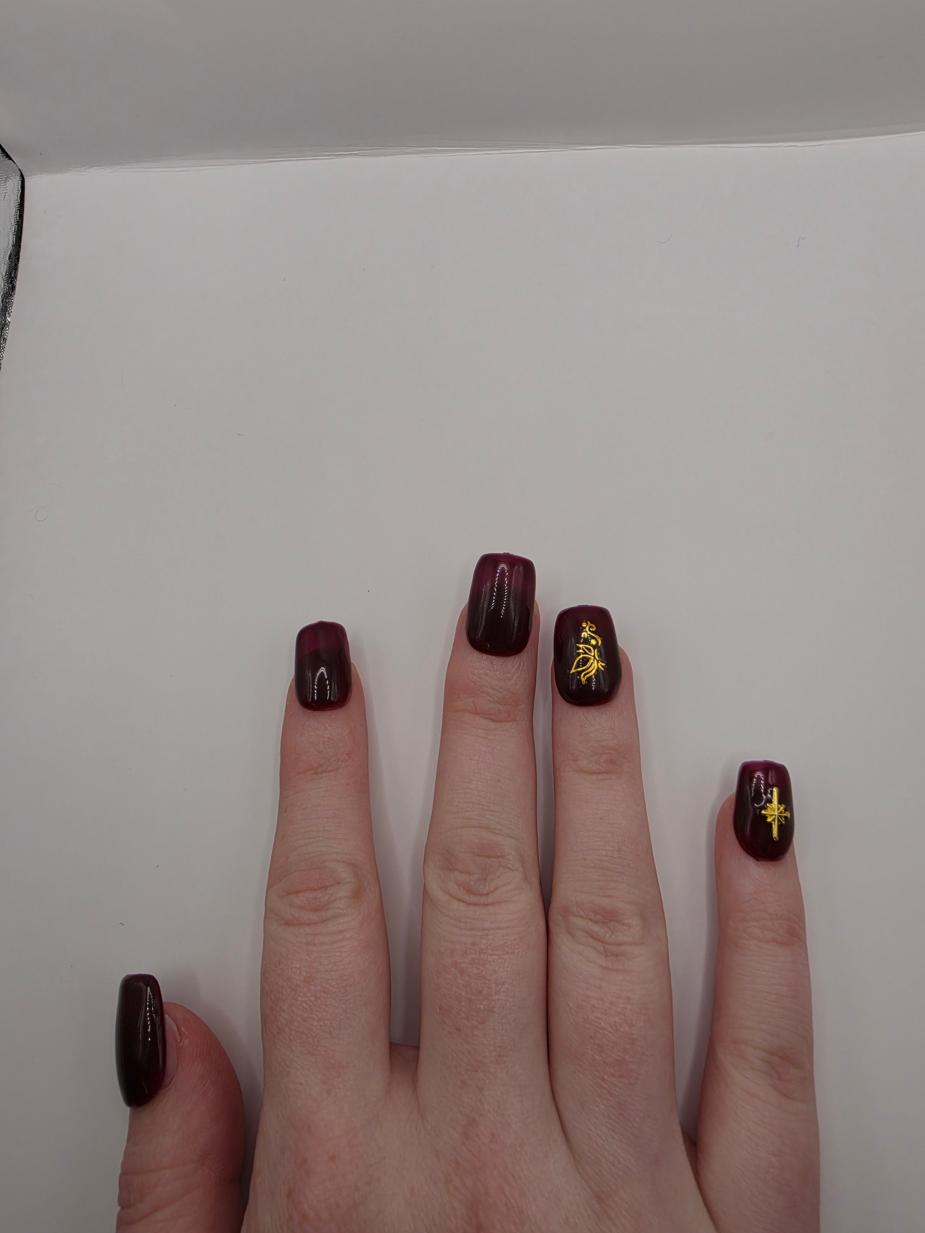 #158 Base Coat: A deliscous dark berry shade with brown undertones decorated with a butterfly design on the ring fingers and an elongated eight-pointed star charm inbedded into the pinky nails designed on short square nails